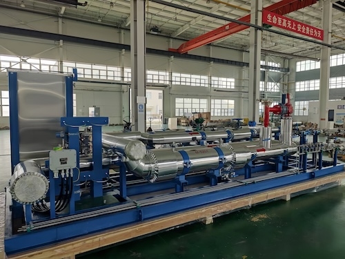 Skid-mounted industrial process piping unit in manufacturing workshop
